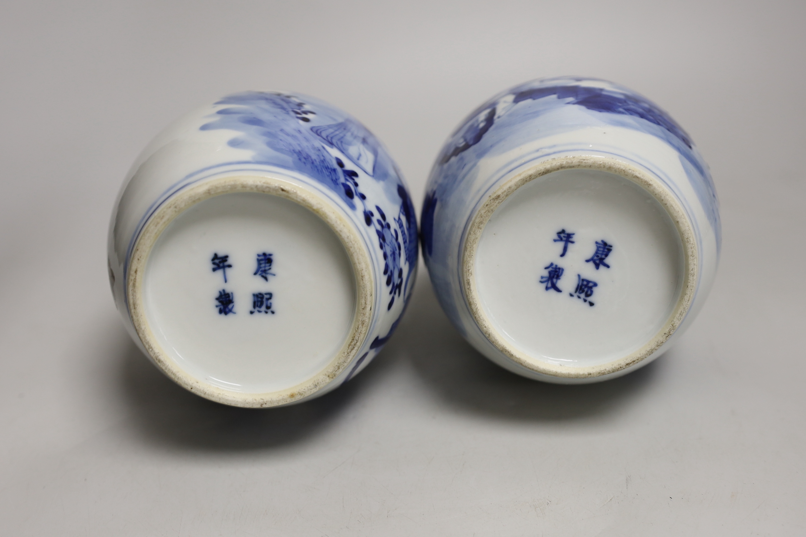 A pair of 19th century Chinese blue and white double gourd vases, 26cm high (a.f.)